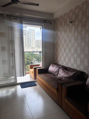 Living Room in 2 BHK Apartment at Bhartiya Nikoo Homes Phase 2, Thanisandra Main Road – for Rent