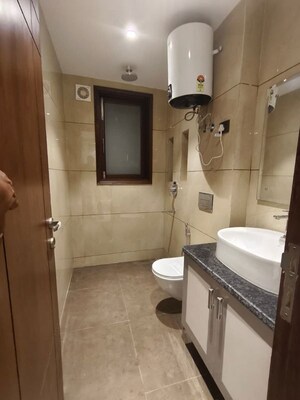 Bathroom in 4 BHK Apartment at Freedom Fighters Enclave – for Rent