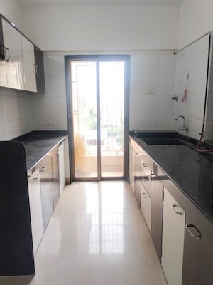 Kitchen in 1 BHK Apartment at Madhav Palacia, Ghodbunder Road – for Sale