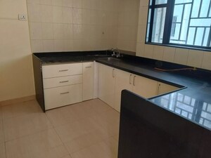 Kitchen in 2 BHK Apartment at Anshul Shree Hans Garden, Dhanori – for Rent