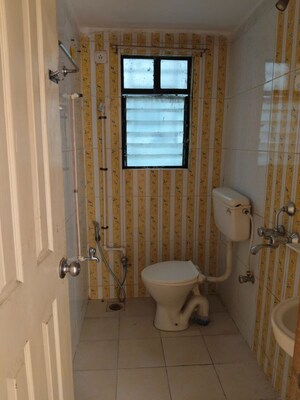 Bathroom in 2 BHK Apartment at Anshul Shree Hans Garden, Dhanori – for Rent