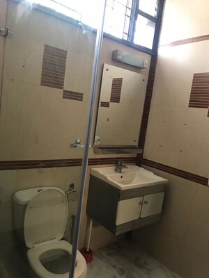 Bathroom in 3 BHK Apartment at Defence Colony – for Rent