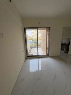 Living Room in 1 BHK Apartment at Metropolis Bayside, Kasarvadavali – for Rent