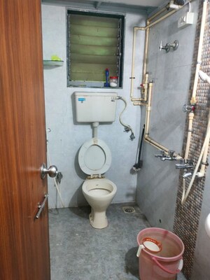 Bathroom in 2 BHK Apartment at Sita Vihar CHS, Naupada – for Sale