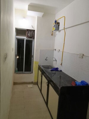 Bathroom in 1 BHK Apartment at Valmiki CHS, Dahisar West – for Rent