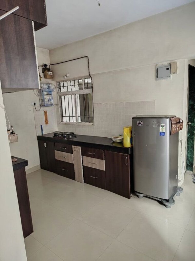 Kitchen, aishwaryam-greens-co-operative-housing-society 1 Bedroom 417 Sq.Ft. Apartment In Wakad Pune 10619119