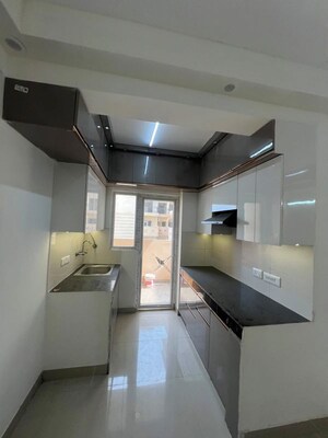 Kitchen in 2 BHK Apartment at AFOWO Raksha Addela, Sector 16c Greater Noida – for Sale