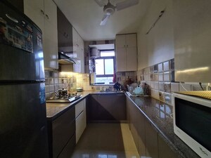 Kitchen in 3.5 BHK Builder Floor at Orchid Island, Sector 51 – for Rent