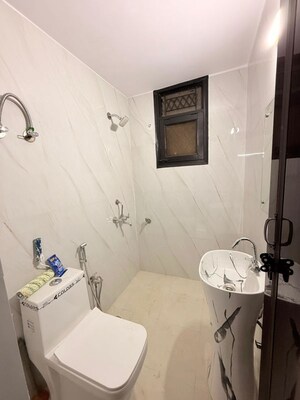Bathroom in 3 BHK Builder Floor at Freedom Fighters Enclave – for Rent