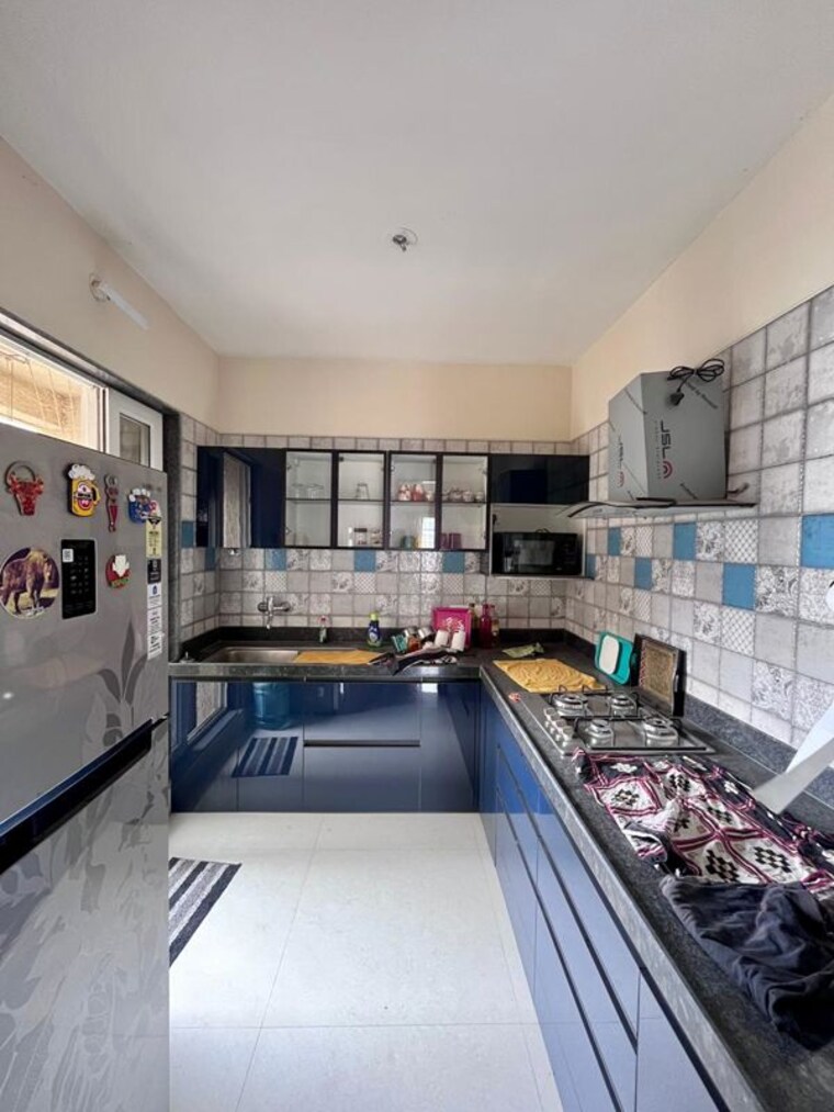 Kitchen, paradise-lifespaces-sai-world-city 2 Bedroom 1000 Sq.Ft. Apartment In New Panvel Navi Mumbai 10619503