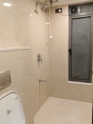 Bathroom in 3 BHK Apartment at Shree Suraj Park Grandeur, Vile Parle West – for Rent