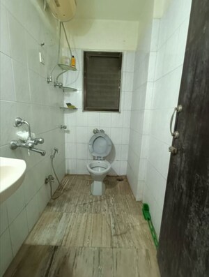 Bathroom in 1 BHK Apartment at New Gitanjali CHS, Malad East – for Rent
