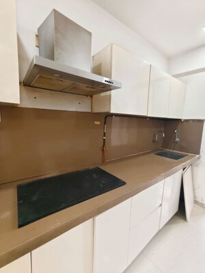 Kitchen in 3 BHK Apartment at Puranik Rumah Bali, Ghodbunder Road – for Rent