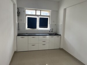 Kitchen in 1 BHK Apartment at Palladium Homes, Dhanori – for Rent