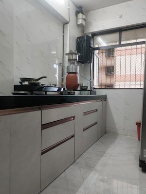 Kitchen in 1 BHK Apartment at Unnathi Woods Phase 1 And 2, Ghodbunder Road – for Sale