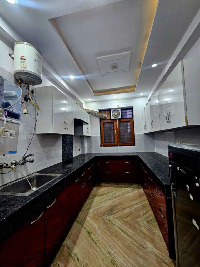 Kitchen, unitech-uniworld-gardens-2 2.5 Bedroom 1250 Sq.Ft. Apartment In Sector 47 Gurgaon 10622722