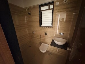 Bathroom in 2 BHK Apartment at Raga Top Towers, Wakad – for Rent