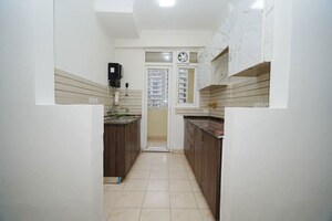 Kitchen in 2.5 BHK Apartment at Amrapali Silicon City, Sector 76 – for Sale