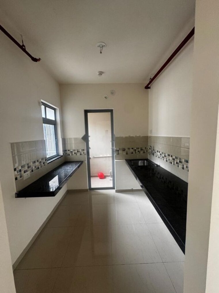 Kitchen, mahindra-happinest-tathawade-phase-1 2 Bedroom 680 Sq.Ft. Apartment In Tathawade Pune 10623523