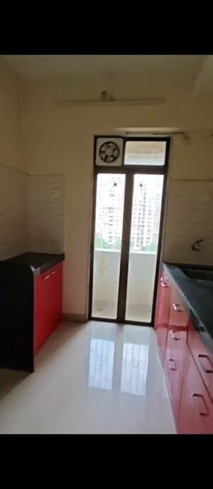 Kitchen in 1 BHK Apartment at Pushpanjali Heights, Owale – for Rent