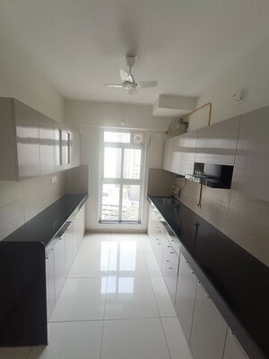 Kitchen in 3 BHK Apartment at Godrej Emerald, Ghodbunder Road – for Rent