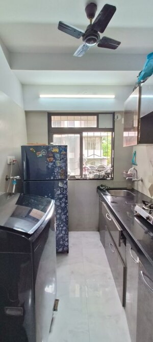 Kitchen in 1 BHK Apartment at Babhai Naka – for Sale