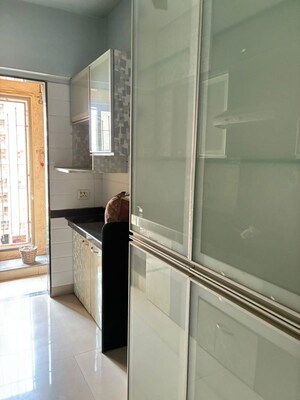 Kitchen in 1.5 BHK Apartment at Madhav Palacia, Ghodbunder Road – for Sale