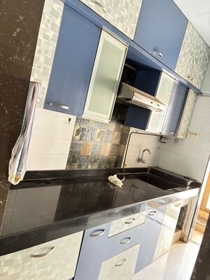 Kitchen in 1.5 BHK Apartment at Madhav Palacia, Ghodbunder Road – for Sale