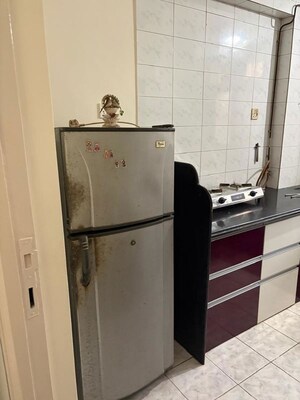 Kitchen in 2 BHK Apartment at Unnati Woods CHS, Kasarvadavali – for Rent