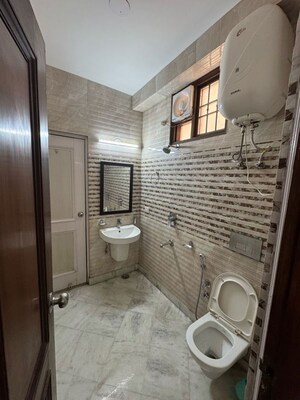 Bathroom in 3 BHK Apartment at Khirki Extension – for Rent