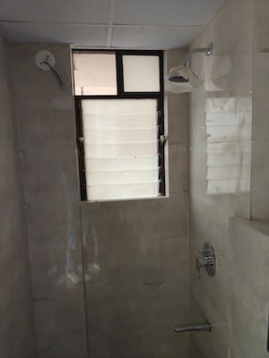 Bathroom in 2 BHK Apartment at Siddha Sky, Sion – for Rent