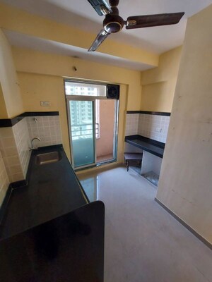 Kitchen in 1 BHK Apartment at T Bhimjyani Verona, Manpada – for Sale