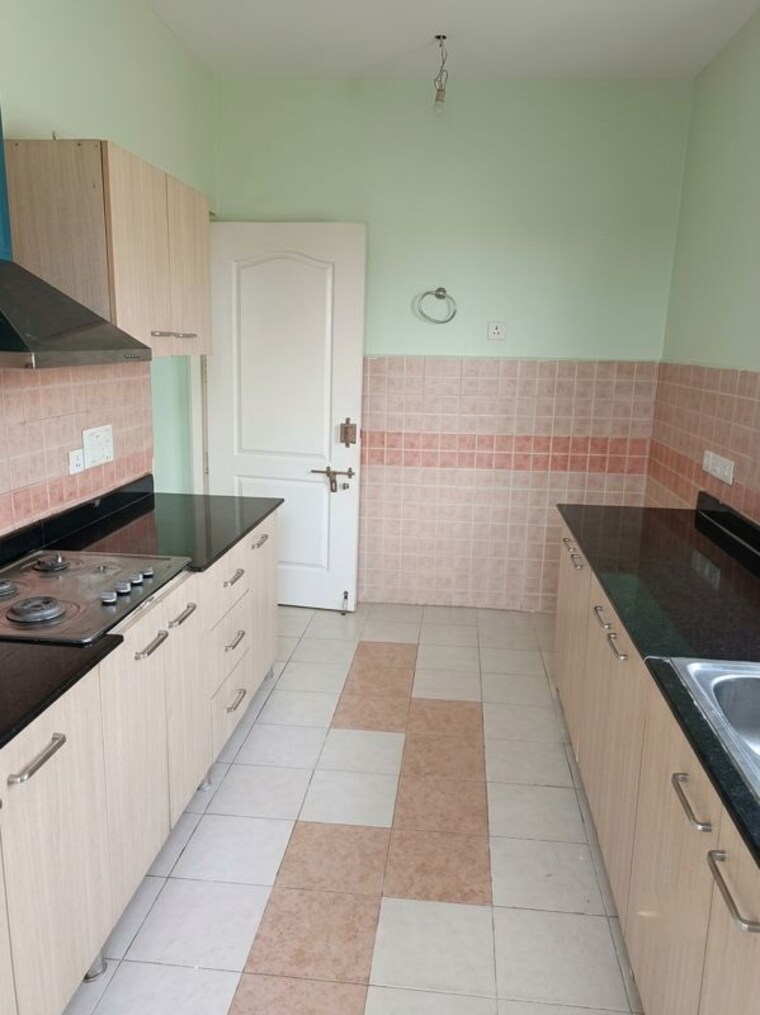 Kitchen, ansal-celebrity-meadows 3.5 Bedroom 2000 Sq.Ft. Apartment In Sushant Golf City Lucknow 10627545