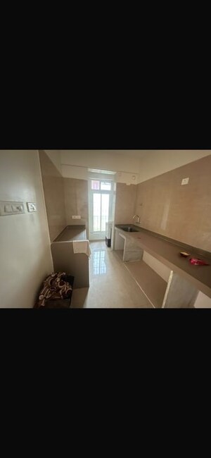 Kitchen in 2 BHK Apartment at Dosti West County, Balkum Pada – for Rent
