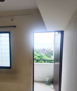 Room in 2 BHK Apartment at Bhoir Estate, Thergaon – for Rent