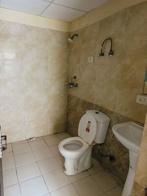 Bathroom in 2 BHK Apartment at Aims Golf City, Sector 75 – for Rent
