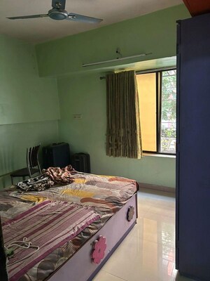 Bedroom in 2 BHK Apartment at Ganadhish Empire CHSL, Pimple Saudagar – for Rent