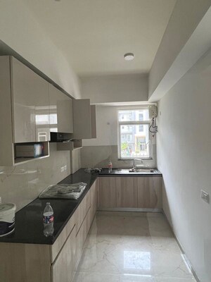 Kitchen in 2.5 BHK Apartment at Smart World Orchard, Sector 61 – for Rent