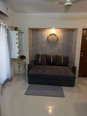 Living Room in 1 BHK Apartment at Raunak Bliss, Ghodbunder Road – for Rent
