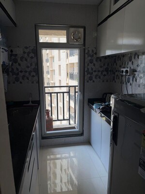 Kitchen in 1 BHK Apartment at Raunak Bliss, Ghodbunder Road – for Rent
