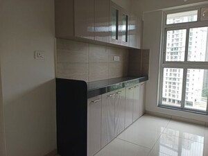 Kitchen in 3 BHK Apartment at Godrej Emerald, Ghodbunder Road – for Rent