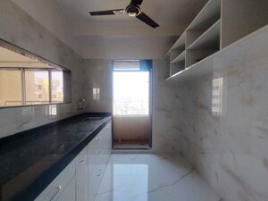 Kitchen in 3 BHK Apartment at Ram Pushpanjali Residency, Owale – for Rent