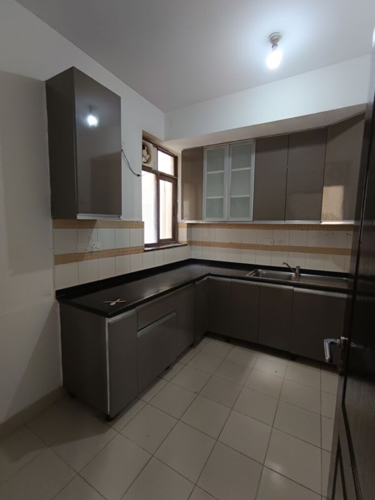 Kitchen, unitech-uniworld-gardens-2 2 Bedroom 1350 Sq.Ft. Apartment In Sector 47 Gurgaon 10630188