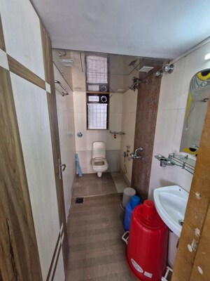 Bathroom in 1.5 BHK Apartment at Puranik Hometown, Ghodbunder Road – for Rent