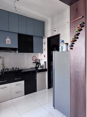 Kitchen in 2 BHK Apartment at Dev Aurum, Prahlad Nagar – for Sale