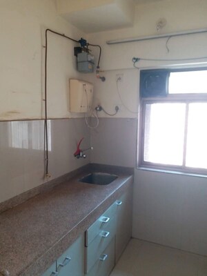 Kitchen in 1 BHK Apartment at Purshottam Nayan, Ghodbunder Road – for Rent