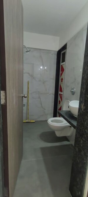 Bathroom in 2 BHK Apartment at Anant Metropolis Insignia Towers, Kasarvadavali – for Rent