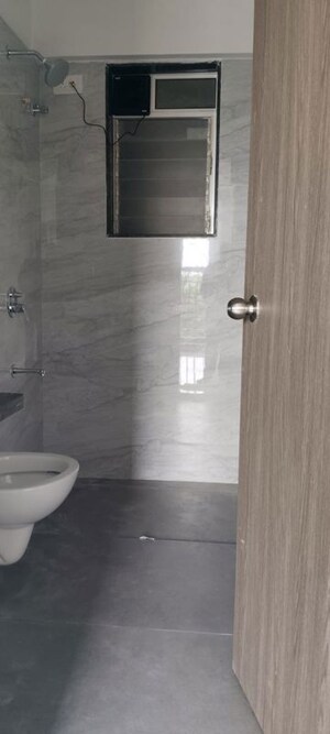 Bathroom in 2 BHK Apartment at Anant Metropolis Insignia Towers, Kasarvadavali – for Rent