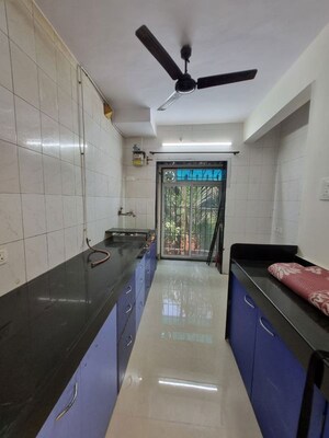 Kitchen in 2 BHK Apartment at Varun Garden, Ghodbunder Road – for Rent