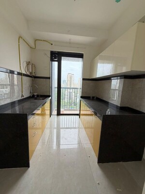 Kitchen in 2 BHK Apartment at Dhamji Shamji Mahavir Spring Tulip Phase 1, Pokhran Road No Two – for Rent